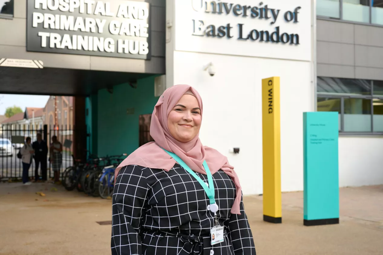 A UEL Nursing Student poses in front of the Primary Care Hub