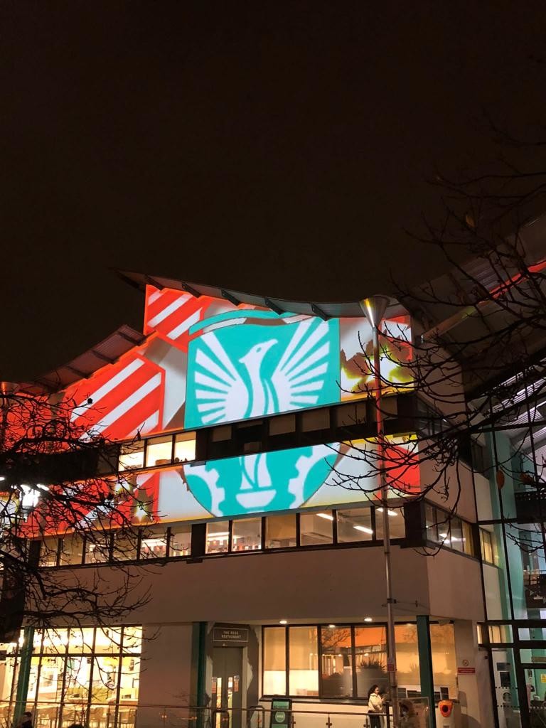UEL logo projected onto Docklands campus