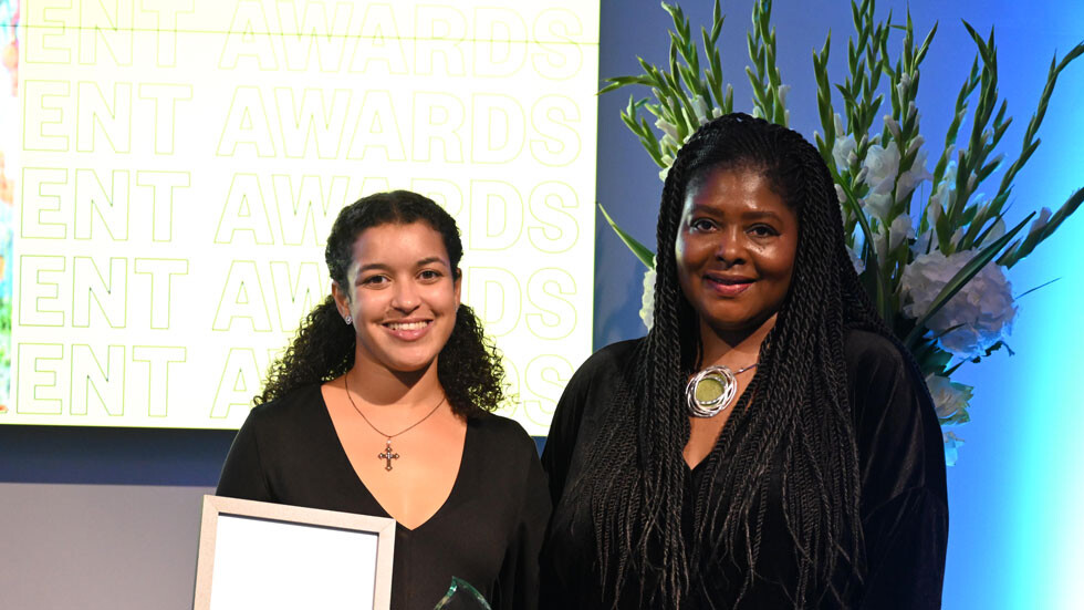 Micha Nestor wins the School of Education and Communities award at the 2022 Alumni Achievement Awards