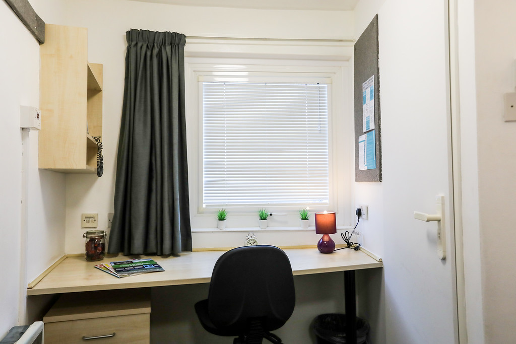 A room in halls of residence desk area