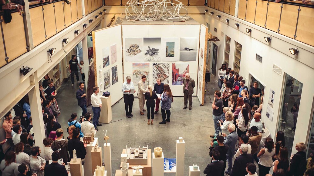 View of people at an exhibition inside a building