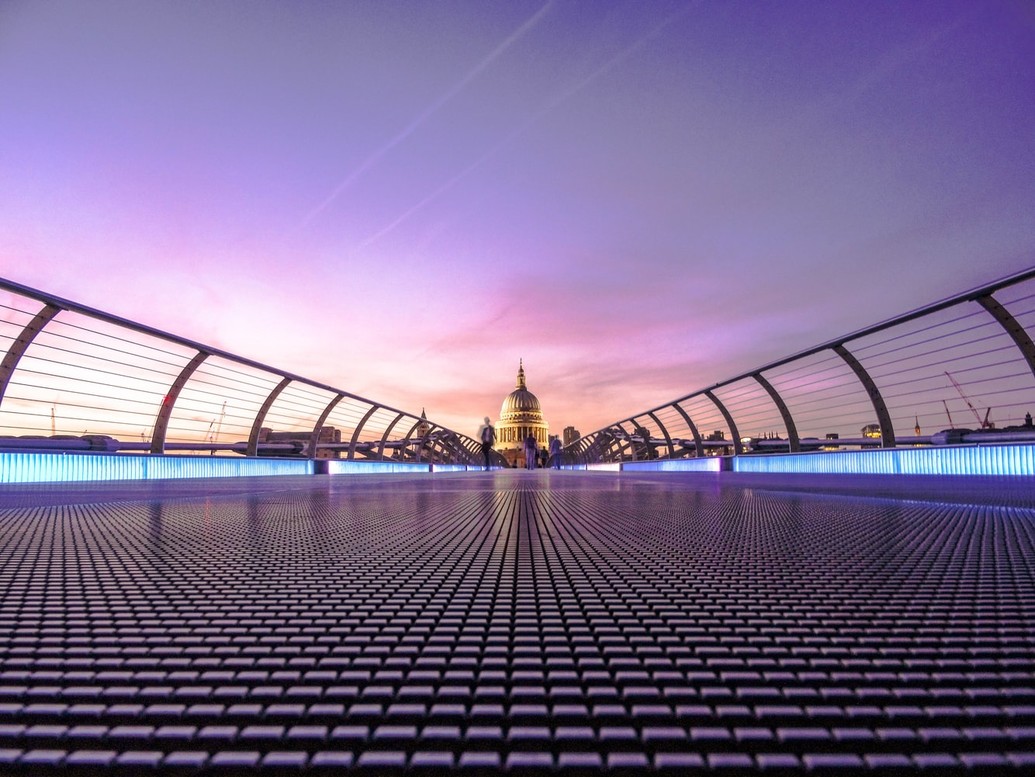 View of Millennium Bridge at night, looking towards St Paul's Cathedral